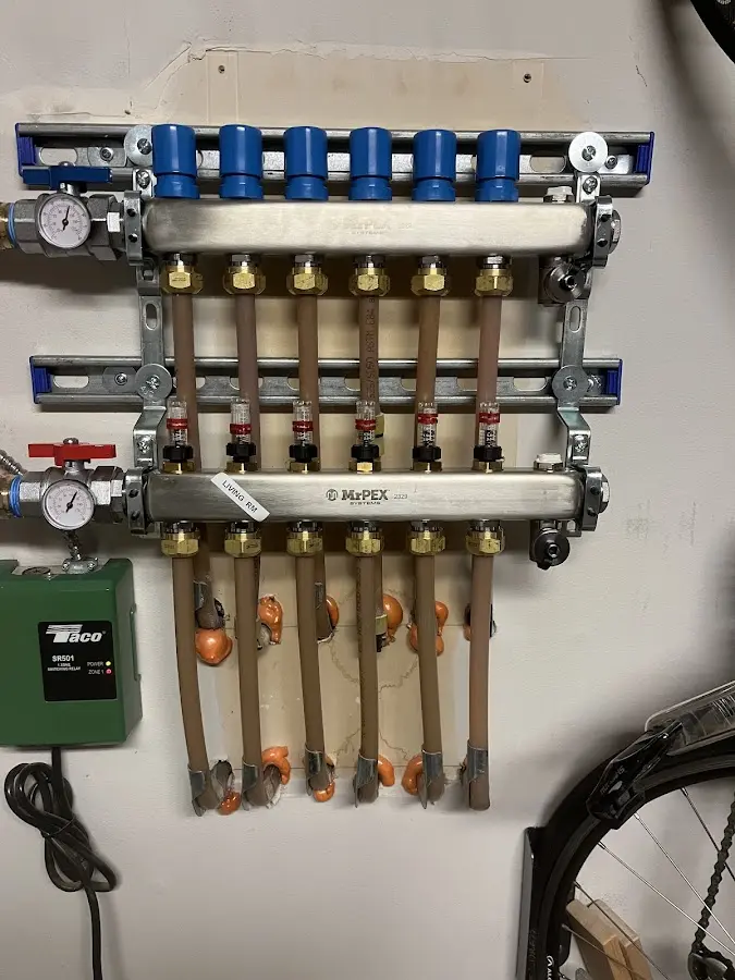 Plumber performing Water Heater Repair at a residential property in Berryville